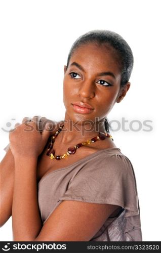 Beautiful African American fashion female face and shoulders with oily skin wearing an amber necklace, isolated.