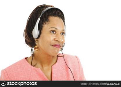 Beautiful african american phone service representative listening to a customer. Isolated on white.