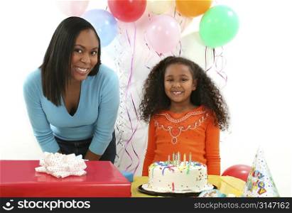 Beautiful African American woman and child with celebrating a birthday