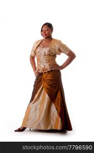 Beautiful African American woman in brown with gold dress, hands on hips and standing, isolated