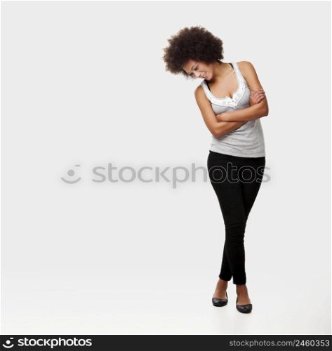Beautiful african american woman isolated on white background and looking down