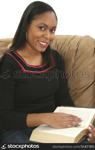 Beautiful African American woman reading a book