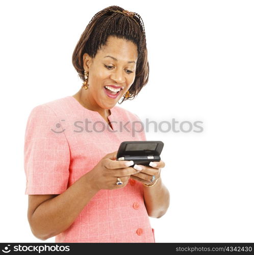 Beautiful african american woman reading an interesting text message. Isolated on white.