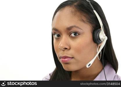 Beautiful African American woman with headset. Shot in studio over white.