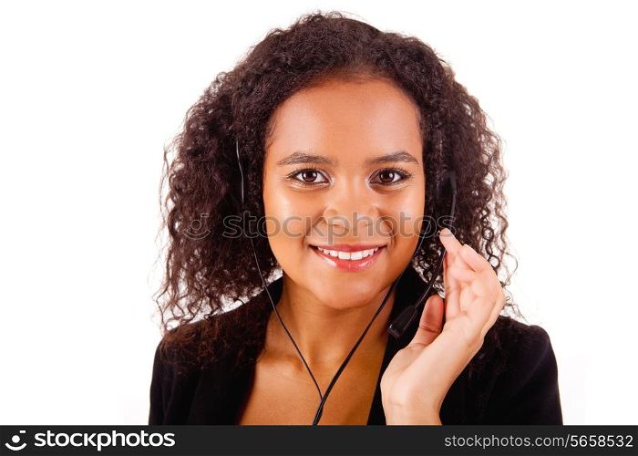 Beautiful african call center woman at work smiling with headset