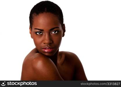 Beautiful African female face with short curly hair looking over shoulder, isolated.