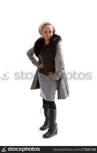 Beautiful African woman wearing gray winter wear, isolated