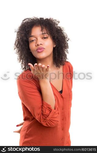 Beautiful african young woman blowing you a kiss, isolated over white