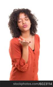 Beautiful african young woman blowing you a kiss, isolated over white