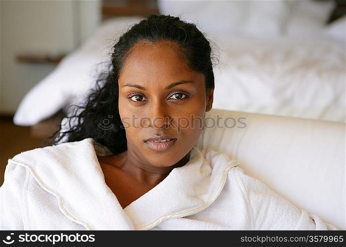 beautiful Afro-American woman relaxing on the couch