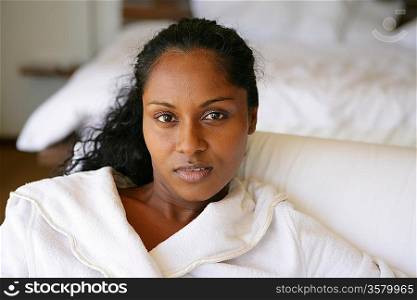 beautiful Afro-American woman relaxing on the couch