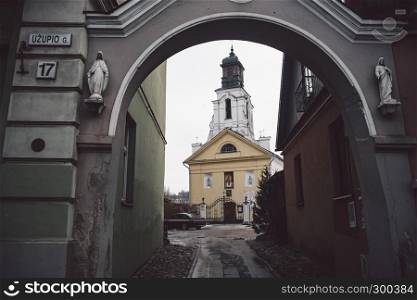 Beautiful ancient ?atholic church in Vilnius. View from arc. Winter season