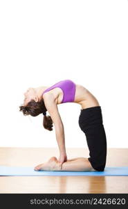 Beautiful and athletic young woman doing yoga exercises