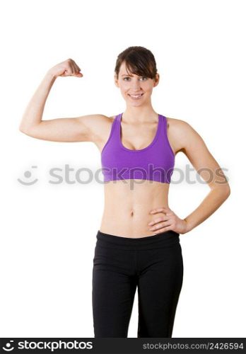Beautiful and athletic young woman posing over a white background