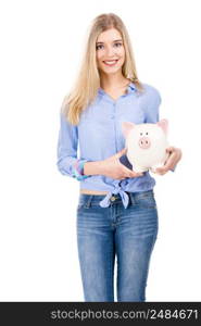 Beautiful and attractive blonde woman holding a piggy bank, isolated over white background