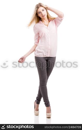 Beautiful and attractive fashion woman smiling and posing, isolated over white background