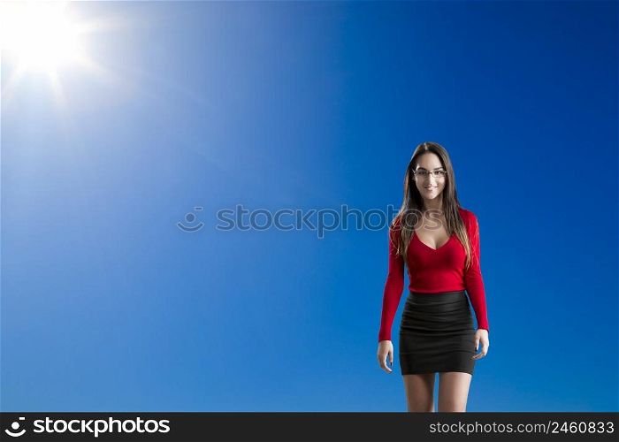 Beautiful and attractive woman against a beautiful blue sky