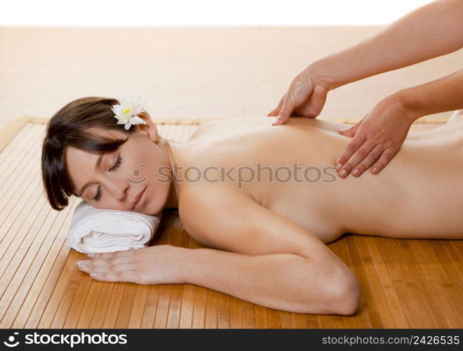 Beautiful and attractive woman on a spa receiving a massage