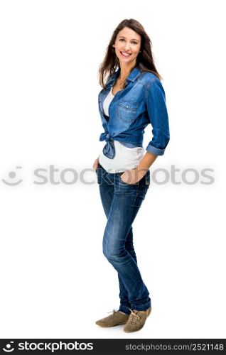 Beautiful and attractive woman wearing a jeans shirt, isolated over white background. Beautiful woman