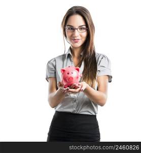 Beautiful and attractive young business woman holding a piggy bank, isolated on white