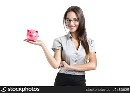 Beautiful and attractive young business woman smiling holding a piggy bank, isolated on white