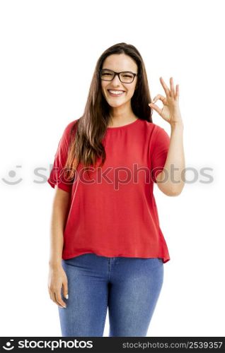 Beautiful and confident woman smiling and doing ok signal, isolated over white background