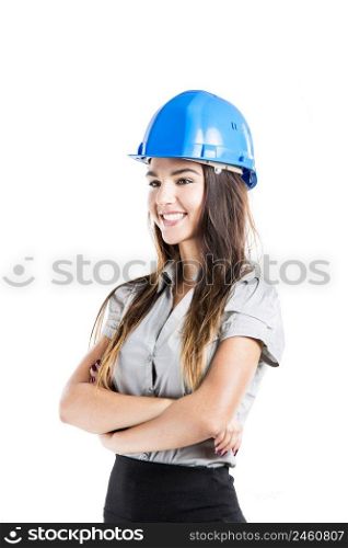 Beautiful and confident young female architect wearing a blue helmet, isolated on white background