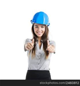 Beautiful and confident young female architect wearing a blue helmet with thumbs up, isolated on white