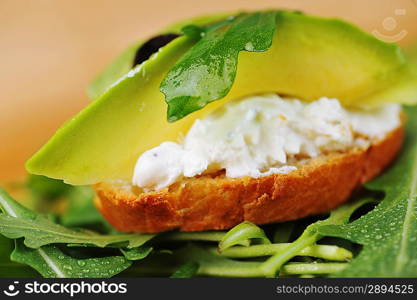 beautiful and delicious sandwich of toasted bread, avocado and spinach