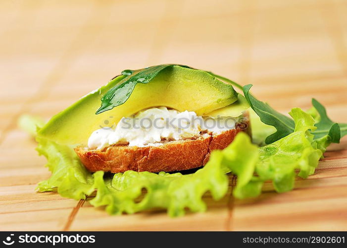 beautiful and delicious sandwich of toasted bread, avocado and spinach