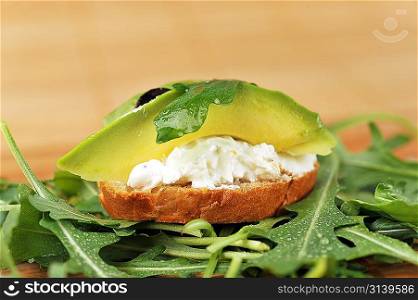 beautiful and delicious sandwich of toasted bread, avocado and spinach
