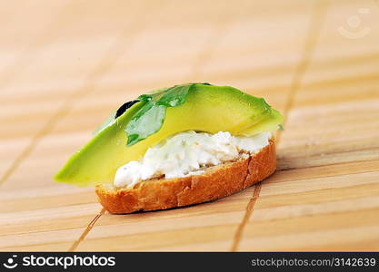 beautiful and delicious sandwich of toasted bread, avocado and spinach