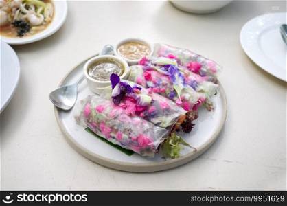 Beautiful and delicious Thai cuisine. Colorful appitizers made from edible flower or THAI NAME   Miang Dok Mai  