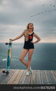 Beautiful and fashion young woman posing with a skateboard