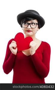 Beautiful and funny nerd girl, holding a paper heart isolated on white background