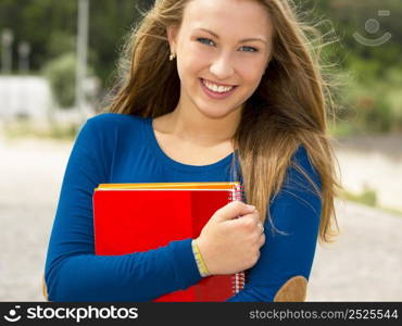 Beautiful and happy teenager student in the school