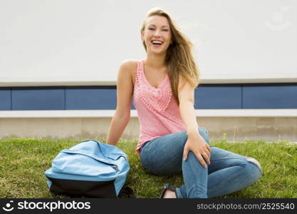 Beautiful and happy teenager studying in outdoor