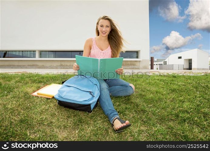 Beautiful and happy teenager studying in outdoor