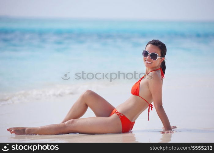 beautiful and happy woman girl on beach have fun and relax on summer vacation over the sea