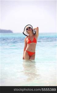 beautiful and happy woman girl on beach have fun and relax on summer vacation over the sea