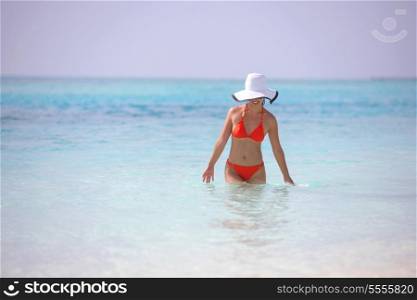beautiful and happy woman girl on beach have fun and relax on summer vacation over the sea