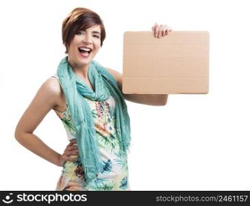Beautiful and happy woman holding a cardboard, isolated over a white background