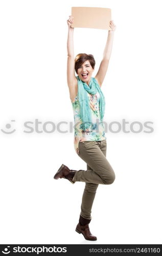 Beautiful and happy woman holding a cardboard, isolated over a white background