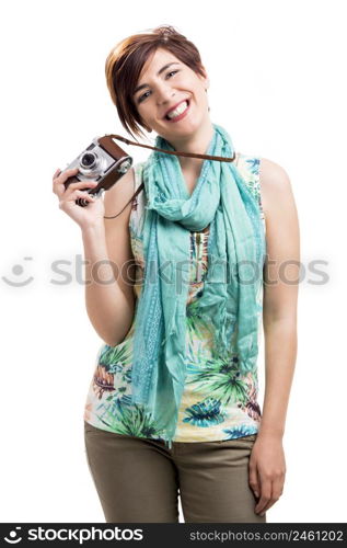 Beautiful and happy woman with a vintage camera, isolated over white background