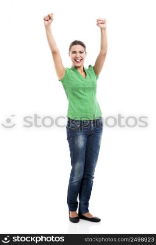Beautiful and happy woman with arms up, isolated over a white background