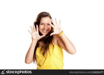 Beautiful and happy young girl with both hands on the air, isolated on white 