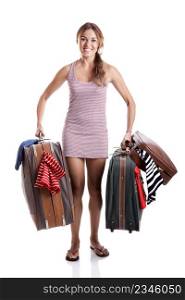 Beautiful and happy young woman carying the baggage with clothes