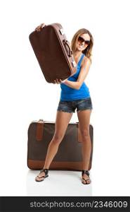 Beautiful and happy young woman holding an old leather suitcases - isolated on white