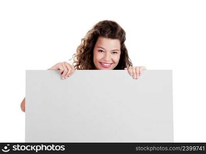 Beautiful and happy young woman isolated on white holding a white billboard 