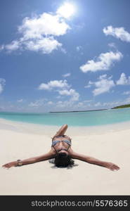 beautiful and happy young woman on beach have fun and relax on summer vacation over the crystal clear sea